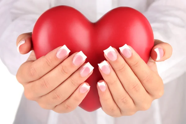 Red heart in woman's hands, on white background close-up — Stock Photo, Image