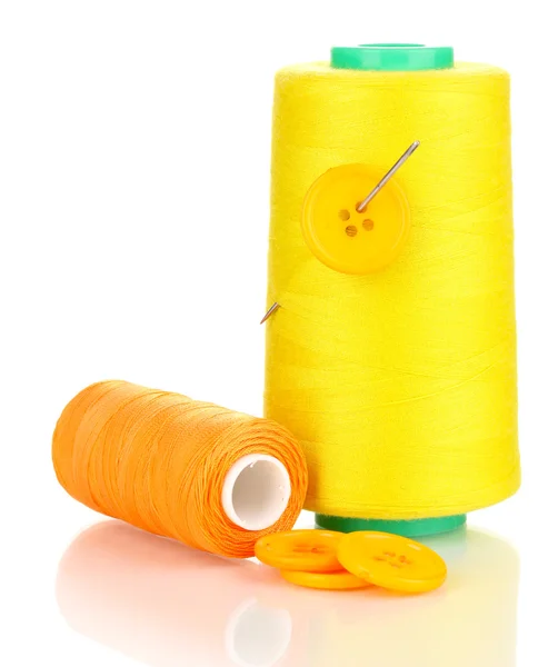 Yellow bobbin with needle and buttons isolated on white — Stock Photo, Image