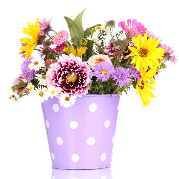 Beautiful bouquet of bright flowers in metal pot isolated on white Stock Photo