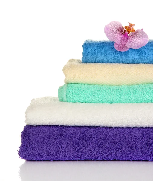 Stack of towels with fragrant flower isolated on white — Stock Photo, Image