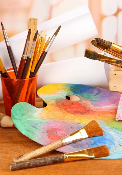 Artistic equipment: paint, brushes and art palette — Stock Photo, Image