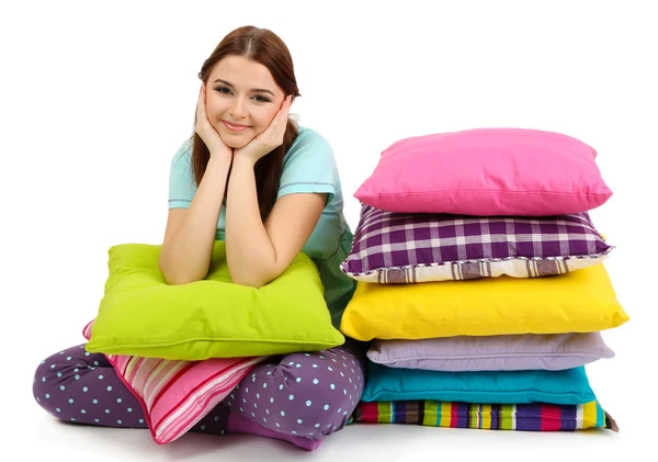 Beautiful young girl with pillows isolated on whit — Stock Photo, Image