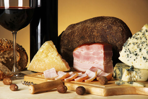 Exquisite still life of wine, cheese and meat products