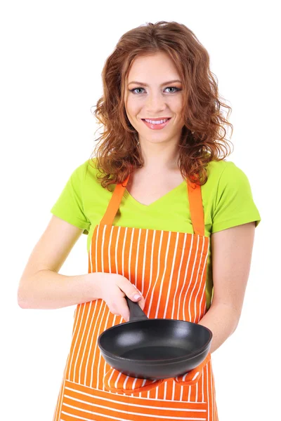 Young woman wearing kitchen apron with pan, isolated on white — Stock Photo, Image