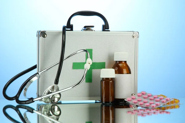 First aid box, on blue background — Stock Photo, Image