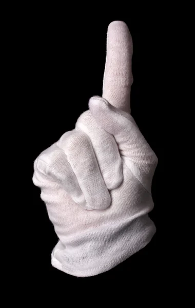 Hand in white glove making sign isolated on black — Stock Photo, Image