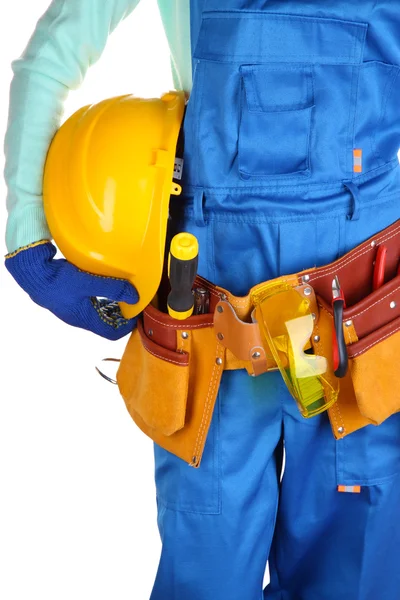 Construtor masculino em macacão azul com capacete amarelo isolado em branco — Fotografia de Stock