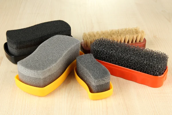 Set of stuff for cleaning and polish shoes, on wooden background — Stock Photo, Image