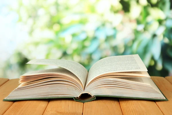 Opened book on bright background — Stock Photo, Image