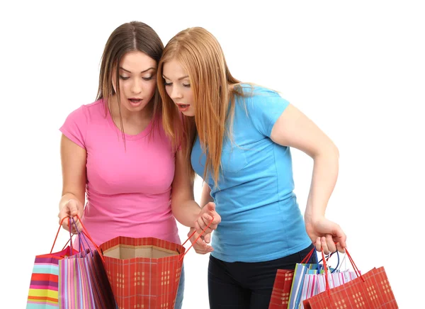 Dos amigas con compras aisladas en blanco — Foto de Stock