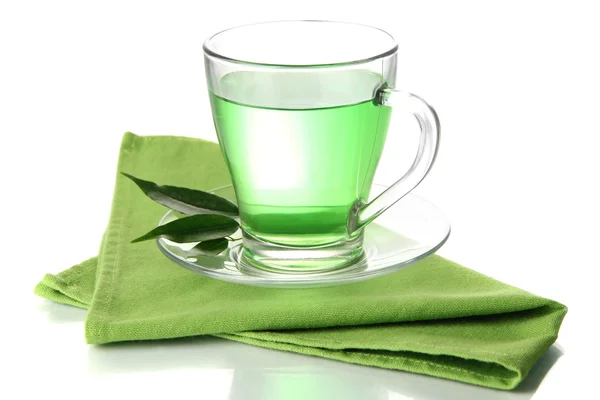 Genomskinlig kopp grönt te på Servett, isolerad på vit — Stockfoto