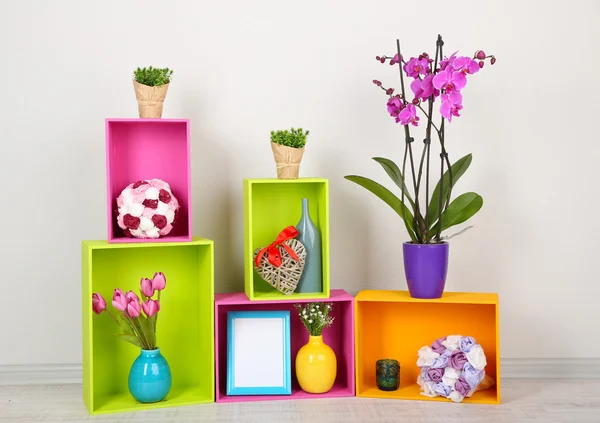 Beautiful colorful shelves with different home related objects — Stock Photo, Image