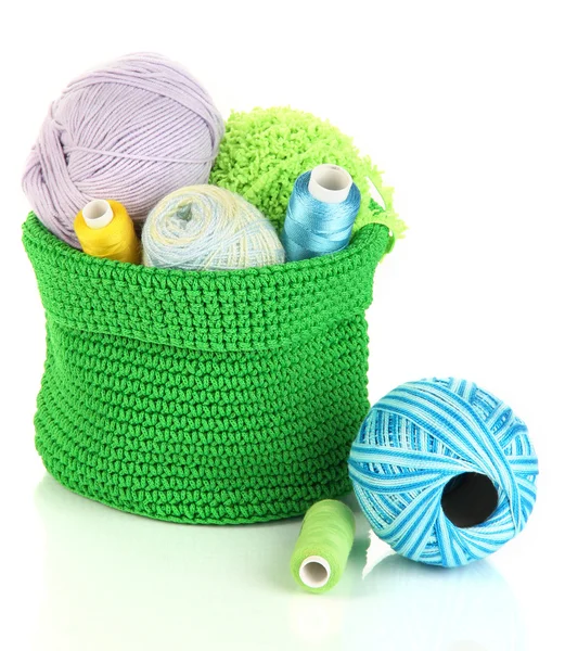 Colorful yarn for knitting in green basket isolated on white — Stock Photo, Image