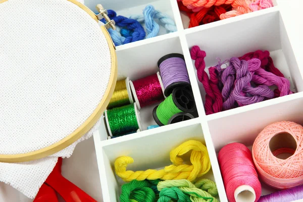 Material for embroidery in white wooden box closeup — Stock Photo, Image