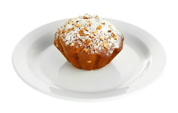 Tasty muffin cake with powdered sugar on plate, isolated on white — Stock Photo, Image