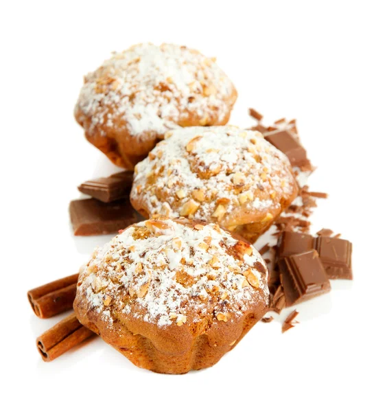 Tasty muffin cakes with powdered sugar and chocolate, isolated on white — Stock Photo, Image