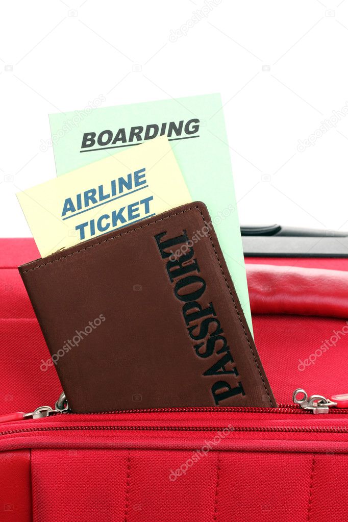 Passport and ticket on suitecase close-up