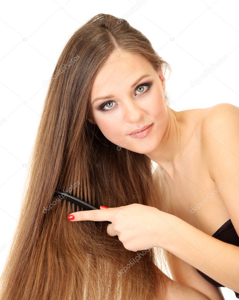 Portrait of beautiful woman brushing her hair, isolated on white