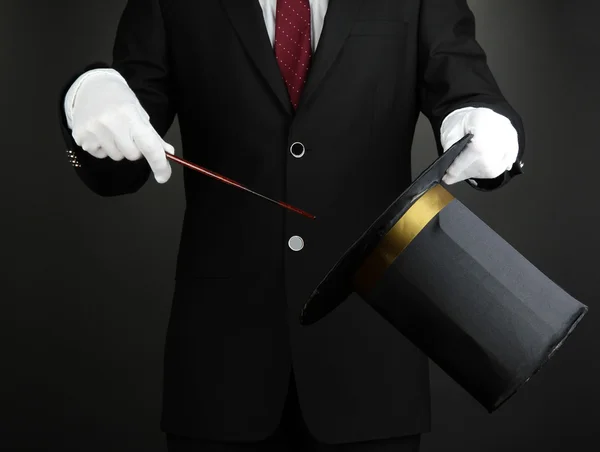 Magician performance on dark background — Stock Photo, Image