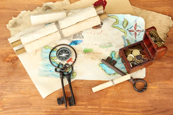 Map of treasures on wooden background — Stock Photo, Image