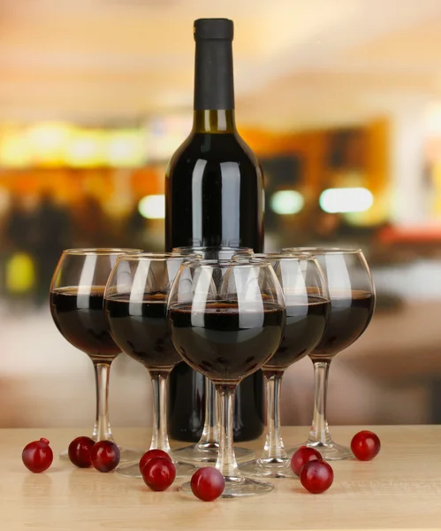 Red wine in glass and bottle on room background — Stock Photo, Image