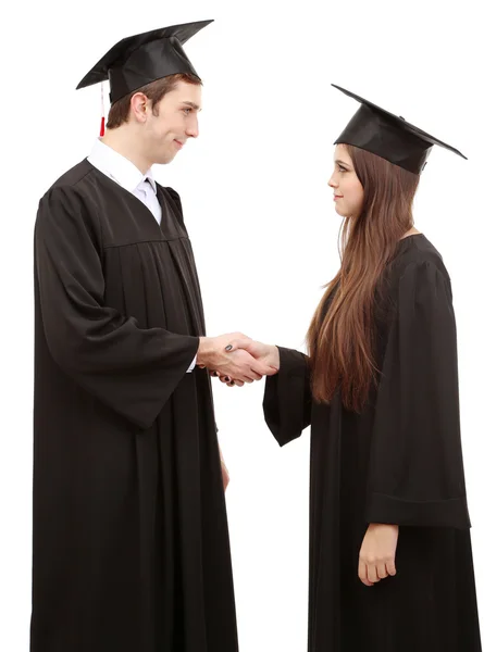 Twee gelukkige afstuderen studenten geïsoleerd op wit — Stockfoto