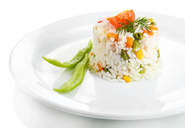 Delicious risotto with vegetables, isolated on white — Stock Photo, Image