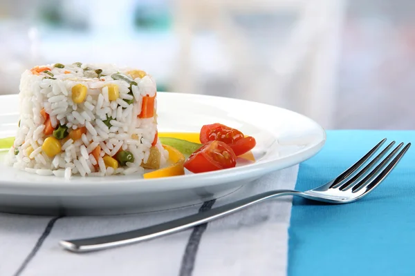 Delicious risotto with vegetables on table in cafe — Stock Photo, Image