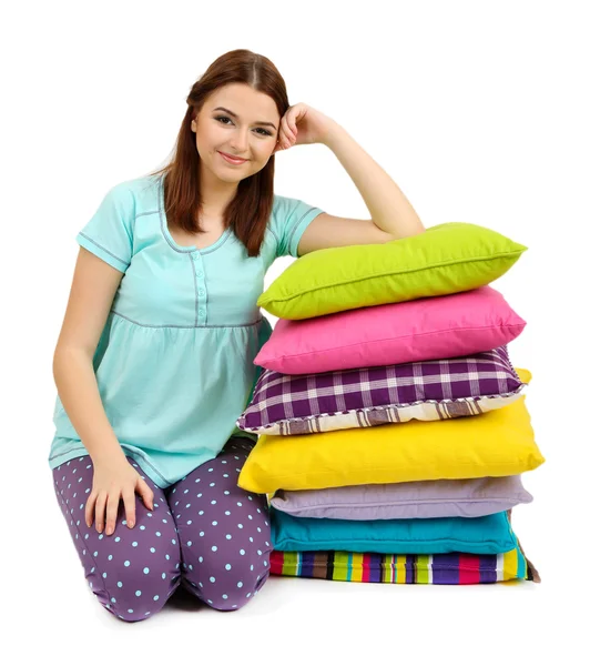 Beautiful young girl with pillows isolated on whit — Stock Photo, Image