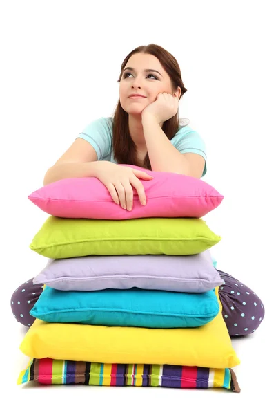 Beautiful young girl with pillows isolated on whit — Stock Photo, Image