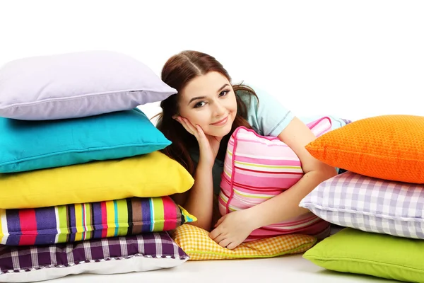 Beautiful young girl with pillows isolated on whit — Stock Photo, Image