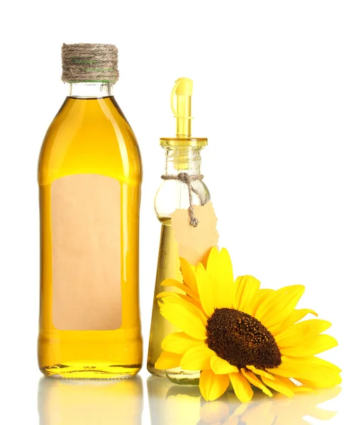 Oil in jars and sunflower, isolated on white — Stock Photo, Image