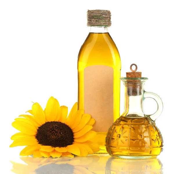 Oil in jars and sunflower, isolated on white — Stock Photo, Image