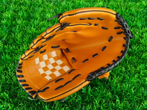 Baseball glove on grass background — Stock Photo, Image