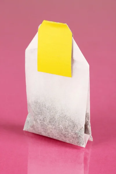 Tea bag on pink background — Stock Photo, Image