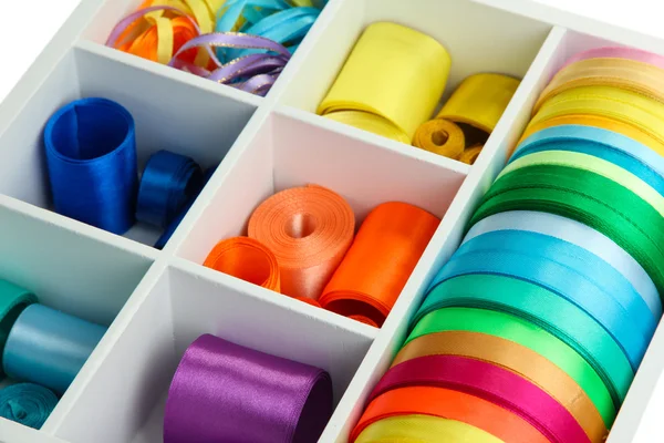 Bright silk ribbons in white wooden box, close up — Stock Photo, Image