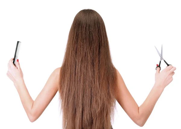 Mulher bonita com cabelos longos e ferramentas de cabeleireiro, isolado em branco — Fotografia de Stock