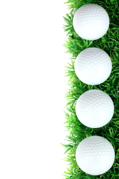 Golf balls on grass isolated on white — Stock Photo, Image