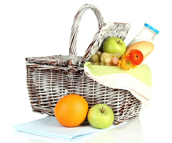 Picnic basket with fruits and bottle of milk, isolated on white — Stock Photo, Image