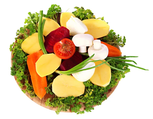 Muchas verduras peladas aisladas en blanco — Foto de Stock