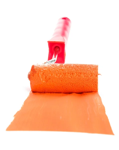 Roller with orange paint isolated on white — Stock Photo, Image