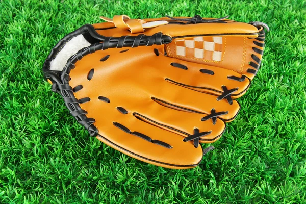 Baseball glove on grass background — Stock Photo, Image