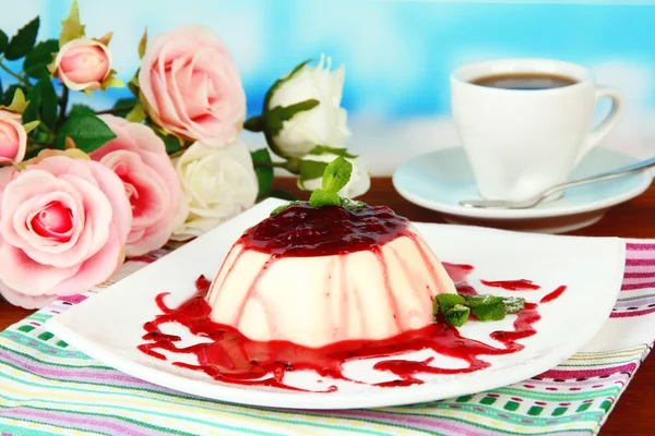 Panna Cotta with raspberry sauce, on bright background — Stock Photo, Image