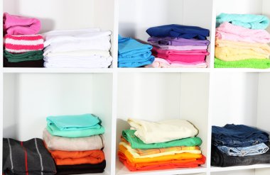 Clothes neatly folded on shelves