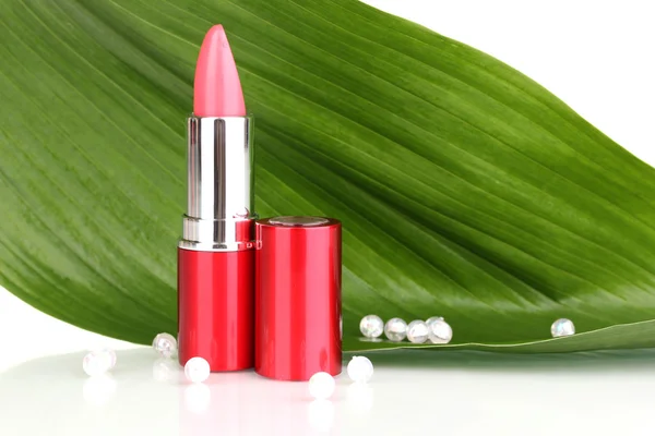 Lipstick on green leaf isolated on white — Stock Photo, Image