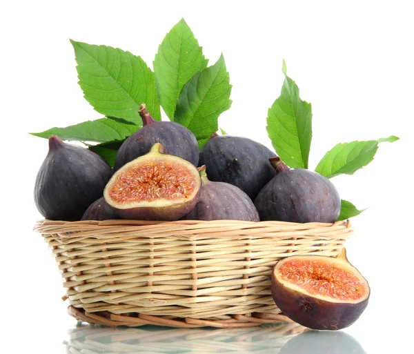 Ripe sweet figs with leaves in basket isolated on white — Stock Photo, Image