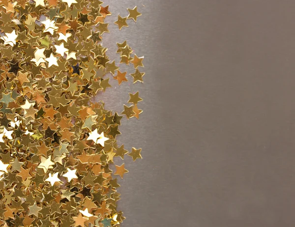 Stars confetti on gray background — Stock Photo, Image