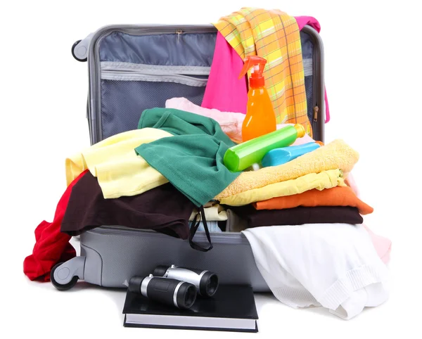 Open silver suitcase with clothing isolated on white — Stock Photo, Image