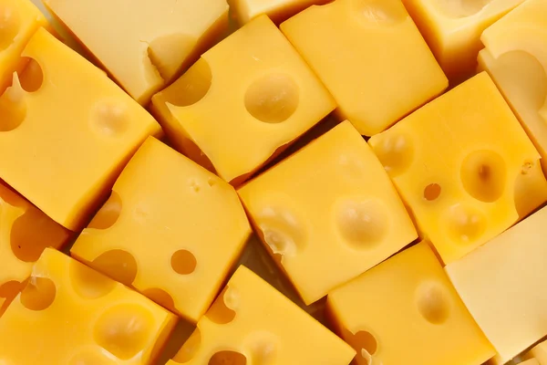 Cheese cubes background — Stock Photo, Image