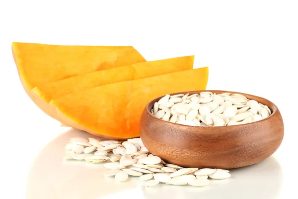 Pumpkin seeds in wooden bowl isolated on the white — Stock Photo, Image